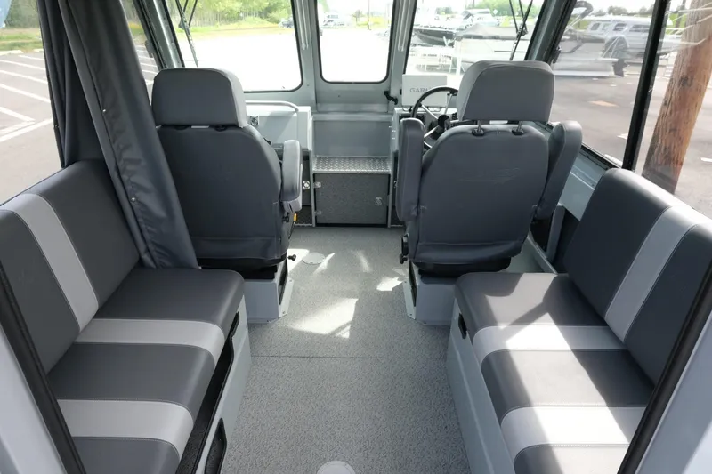 Slide: The Image of 2022 Hewescraft 210 Sea Runner ET Hardtop interior with gray seating and steering console. - 16