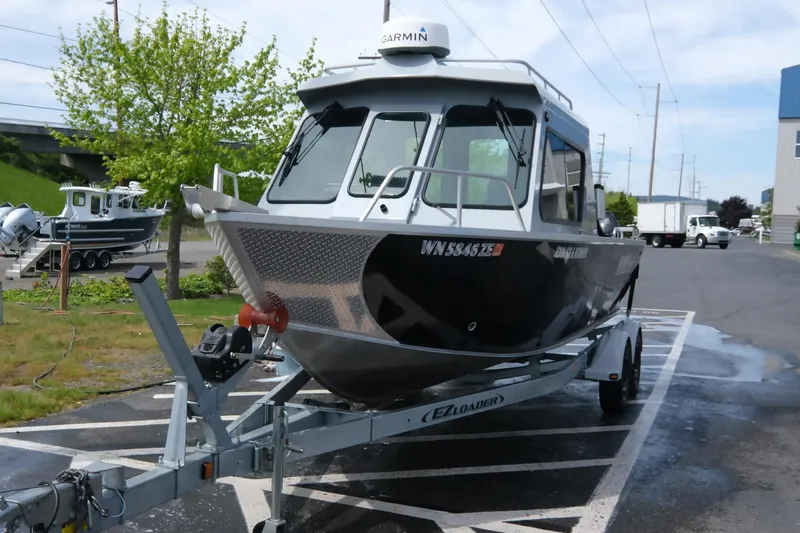 Slide: The Image of 2022 Hewescraft 210 Sea Runner ET Hardtop boat on trailer in parking lot. - 9