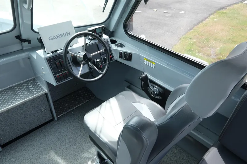 Slide: The Image of Interior of 2022 Hewescraft 210 Sea Runner ET Hardtop with Garmin navigation system. - 19