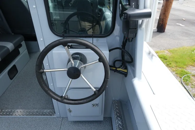 Slide: The Image of Steering wheel of 2022 Hewescraft 210 Sea Runner ET Hardtop boat interior. - 14