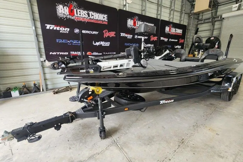 Slide: The Image of 2026 Triton 20XP fishing boat in showroom, featuring sleek design and advanced equipment. - 1