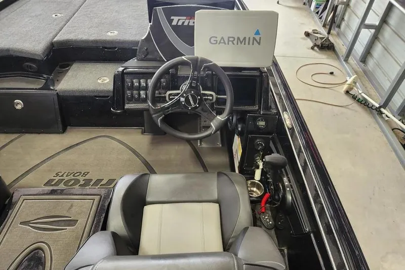 Slide: The Image of Interior of a 2026 Triton 20XP boat with Garmin navigation system. - 8