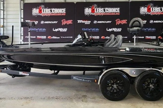 The Image of 2026 Triton 20XP boat on display at Angler's Choice event, featuring sleek black design. - 0