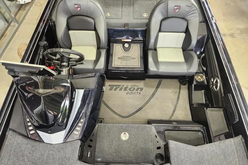 Slide: The Image of 2026 Triton 20XP boat interior with dual seats, steering console, and branded flooring. - 6