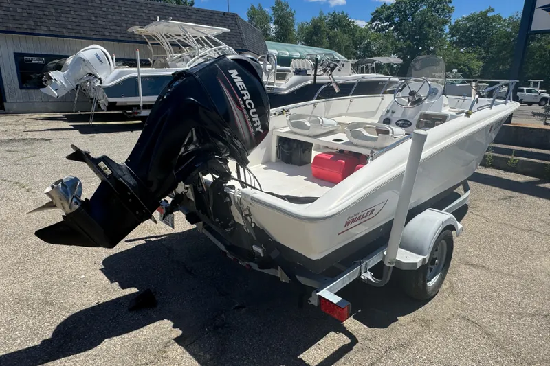 Slide: The Image of 2014 Boston Whaler 150 Super Sport boat with Mercury outboard motor on trailer. - 6