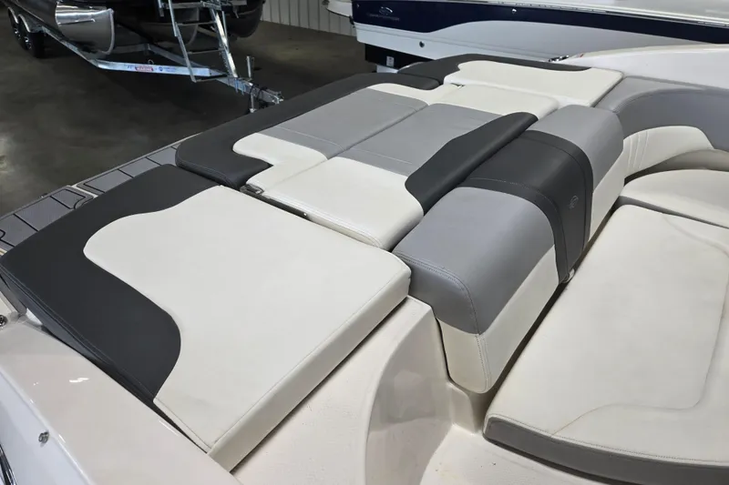 Slide: The Image of 2023 Chaparral 23 SSi boat interior with sleek, modern seating design. - 11