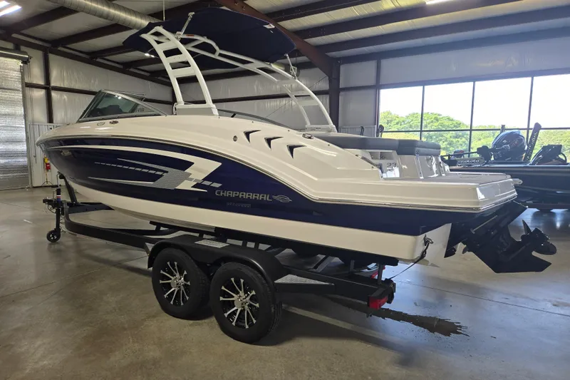 Slide: The Image of 2023 Chaparral 23 SSi boat on trailer in indoor showroom. - 4