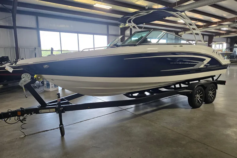 Slide: The Image of 2023 Chaparral 23 SSi boat on trailer in indoor showroom. - 3