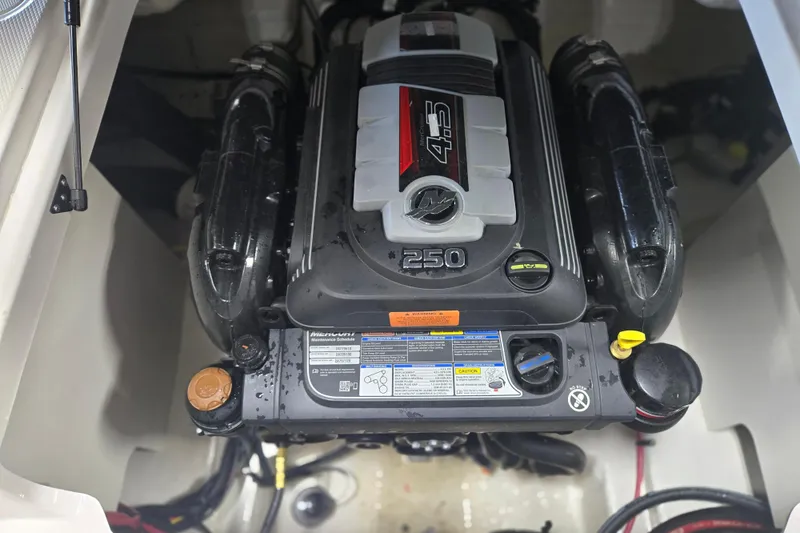 Slide: The Image of 2023 Chaparral 23 SSi boat engine compartment with Mercury 4.5L 250 HP engine. - 16