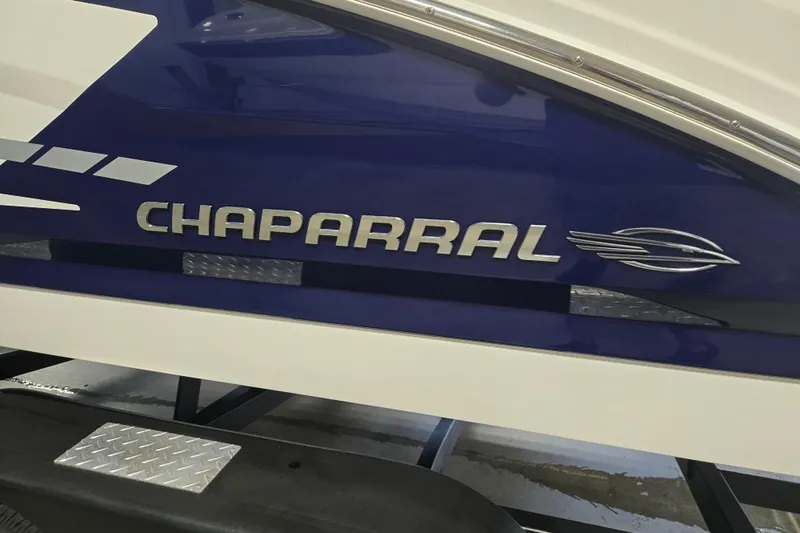 Slide: The Image of 2023 Chaparral 23 SSi boat side view with logo and sleek design. - 5