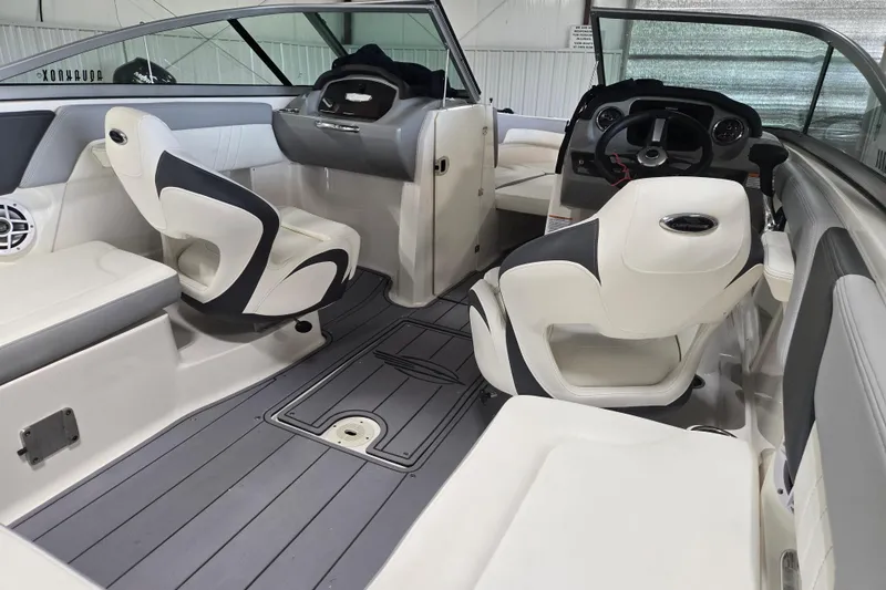 Slide: The Image of Interior of 2023 Chaparral 23 SSi boat with modern seating and steering console. - 10