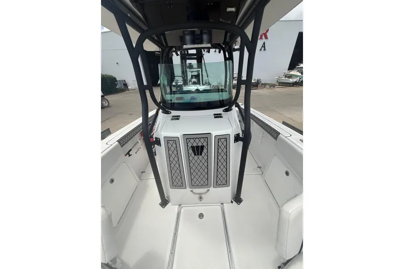 Slide: The Image of 2022 Wellcraft 262 Fisherman boat interior with seating and storage compartments. - 5