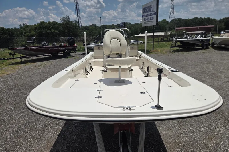 Slide: The Image of 2022 Carolina Skiff 21 LS boat displayed outdoors on a sunny day. - 3