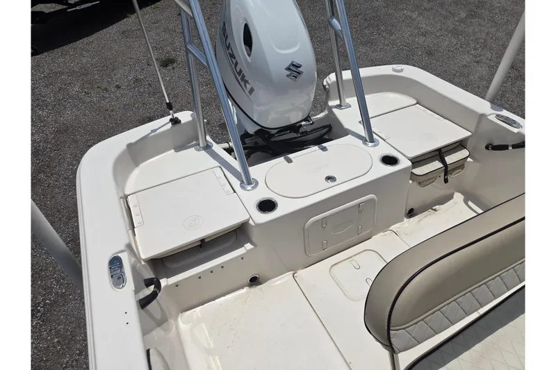 Slide: The Image of 2022 Carolina Skiff 21 LS boat interior with Suzuki outboard motor. - 12