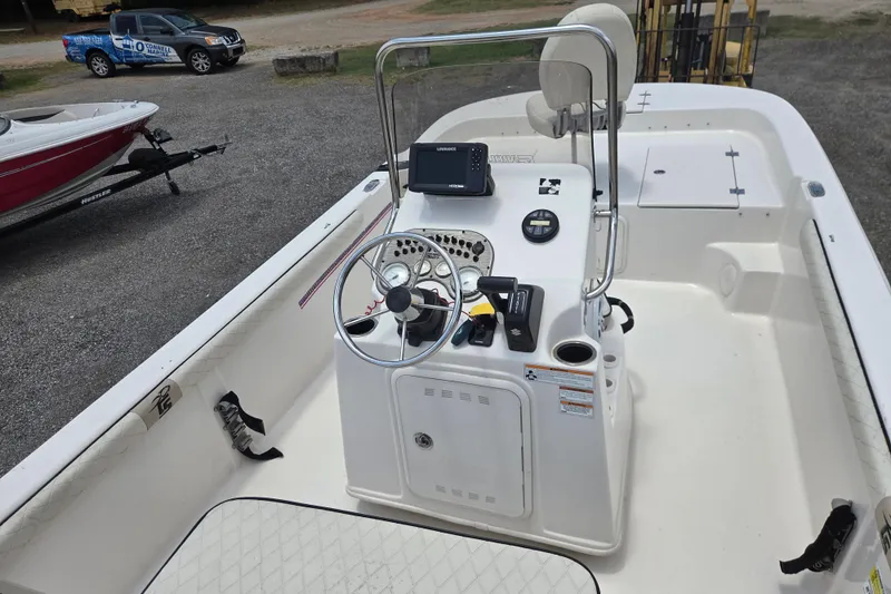 Slide: The Image of 2022 Carolina Skiff 21 LS boat interior with steering console and navigation equipment. - 10