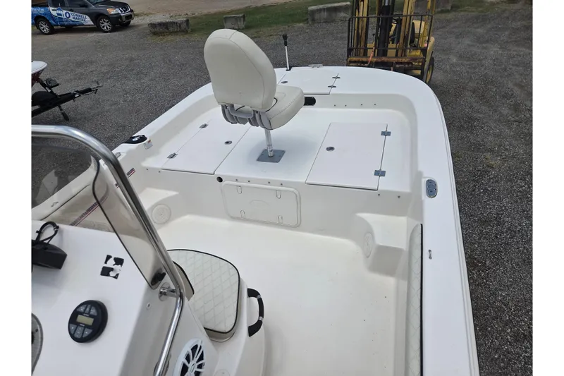 Slide: The Image of 2022 Carolina Skiff 21 LS boat interior with seating and storage compartments. - 17