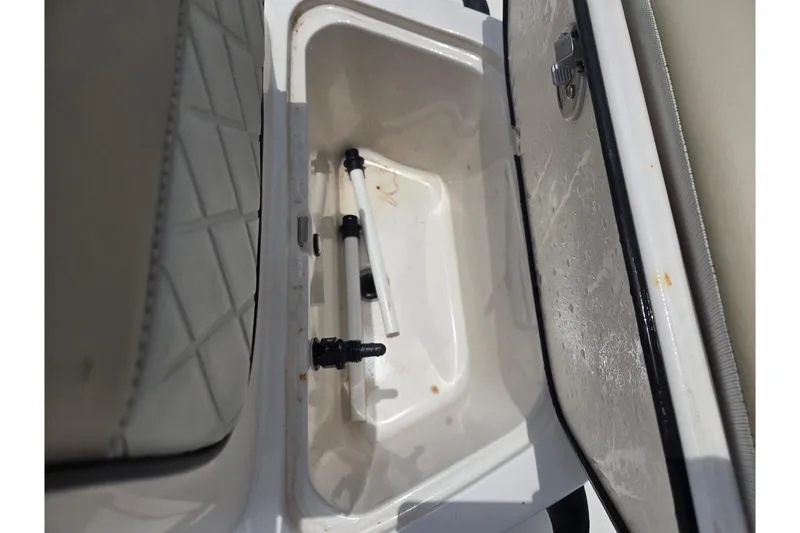 Slide: The Image of Open storage compartment in 2022 Carolina Skiff 21 LS boat, featuring interior fittings. - 13