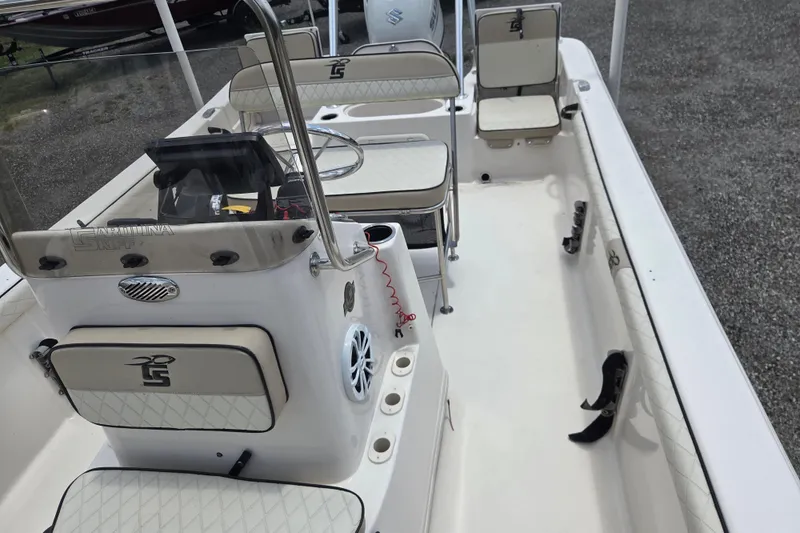 Slide: The Image of 2022 Carolina Skiff 21 LS boat interior with seating and steering console. - 9