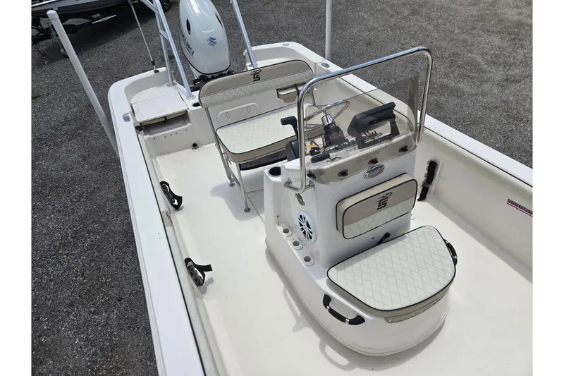 Slide: The Image of 2022 Carolina Skiff 21 LS boat interior with seating and console, showcasing modern design. - 14
