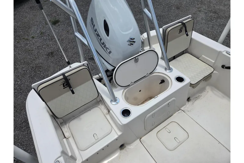 Slide: The Image of 2022 Carolina Skiff 21 LS boat interior with Suzuki engine and seating. - 11