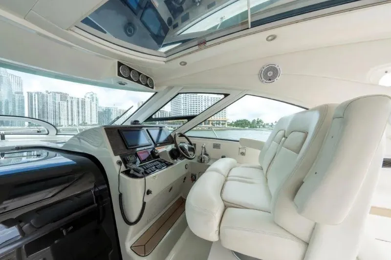 Slide: The Image of Luxurious interior of 2009 Sea Ray 43 Sundancer yacht with modern helm and plush seating. - 48