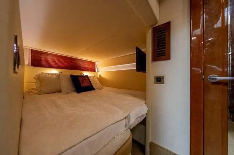 Slide: The Image of Luxurious cabin interior of 2009 Sea Ray 43 Sundancer yacht with cozy bedding. - 28