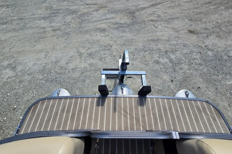 Slide: The Image of Top view of 2016 Manitou 23 Oasis SR pontoon boat on gravel surface. - 4