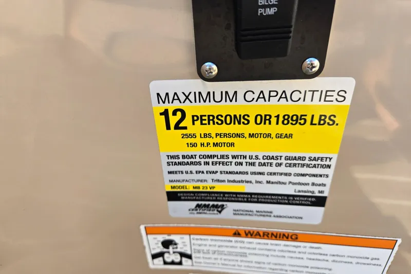 Slide: The Image of 2016 Manitou 23 Oasis SR capacity label: 12 persons or 1895 lbs, 150 HP motor. - 46