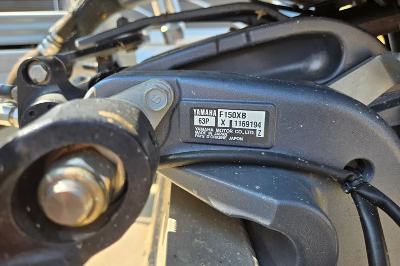 Slide: The Image of Close-up of Yamaha F150XB engine part on 2016 Manitou 23 Oasis SR boat. - 43