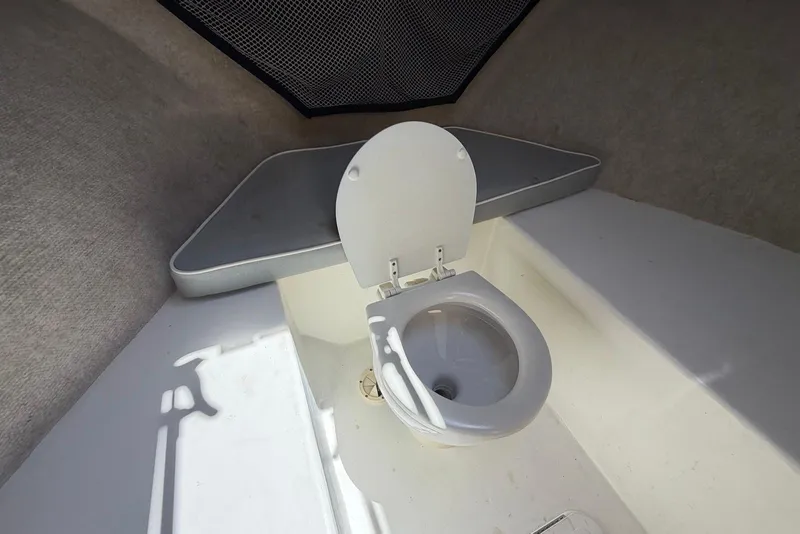 Slide: The Image of Interior of 2016 Parker 2820 XLD Sport Cabin featuring a compact marine toilet. - 22