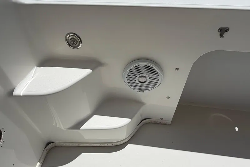 Slide: The Image of Interior detail of a 2016 Parker 2820 XLD Sport Cabin boat, featuring a speaker and step. - 16