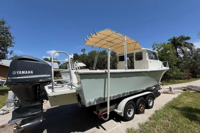 Slide: The Image of 2016 Parker 2820 XLD Sport Cabin boat on trailer with Yamaha outboard motor. - 6