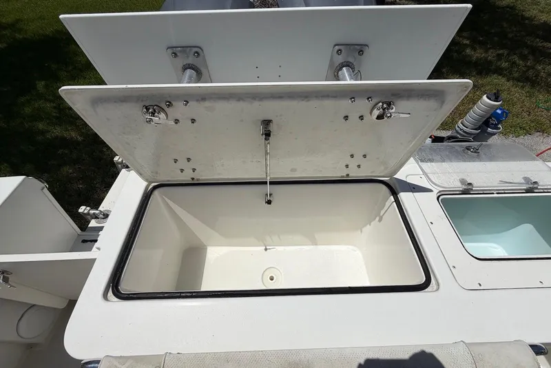 Slide: The Image of Open storage compartment on a 2016 Parker 2820 XLD Sport Cabin boat. - 14