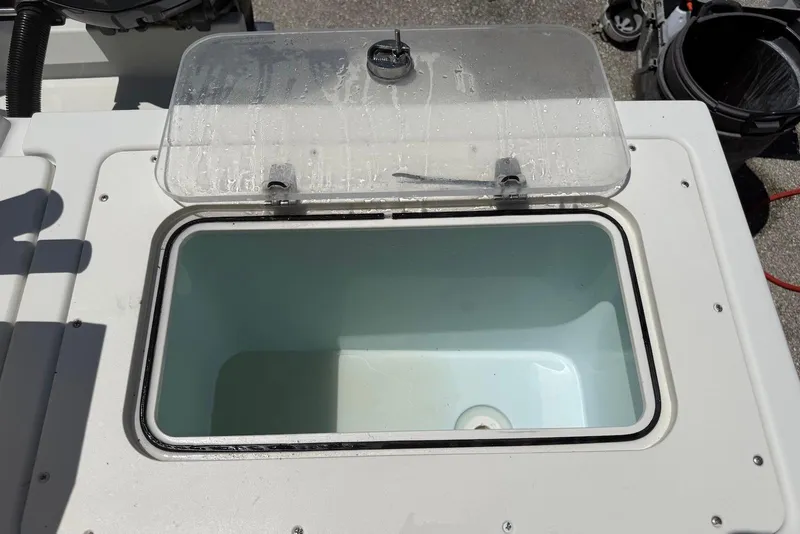 Slide: The Image of Open storage compartment on 2016 Parker 2820 XLD Sport Cabin boat. - 12