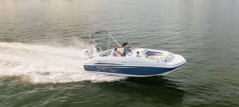 Slide: The Image of A 2021 Hurricane 188 SunDeck Sport speeding across the water. - 11