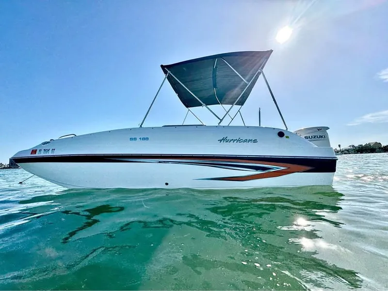The Image of A 2021 Hurricane 188 SunDeck Sport -OB on calm water with a sunshade. - 0