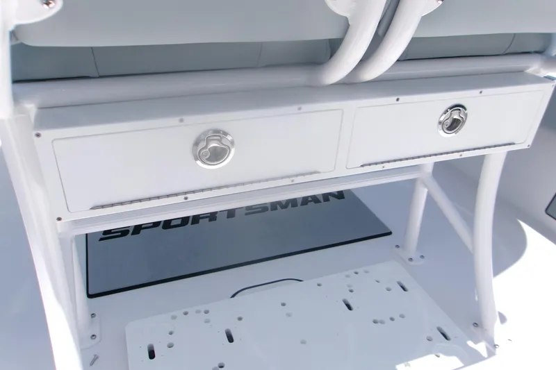 Slide: The Image of 2027 Sportsman Masters 247OE Bay Boat storage drawers and seating area. - 11
