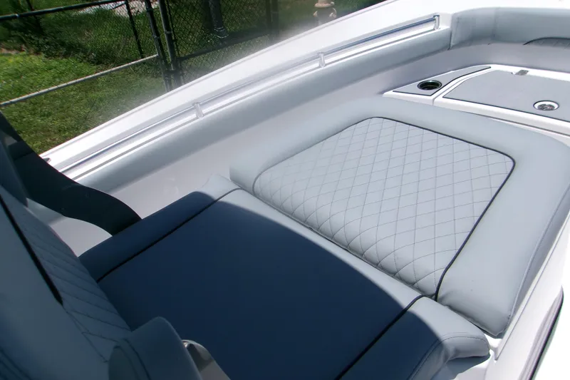 Slide: The Image of 2027 Sportsman Masters 247OE Bay Boat interior with quilted seating and sleek design. - 12