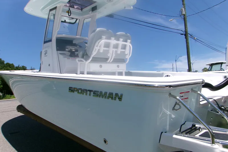 Slide: The Image of 2027 Sportsman Masters 247OE Bay Boat, sleek design, white exterior, sunny day background. - 20