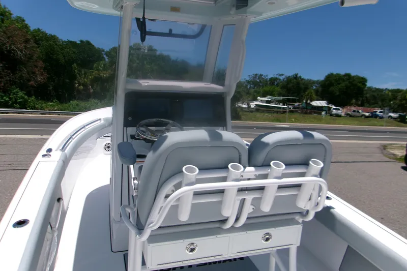Slide: The Image of 2027 Sportsman Masters 247OE Bay Boat interior with dual seats and rod holders. - 5