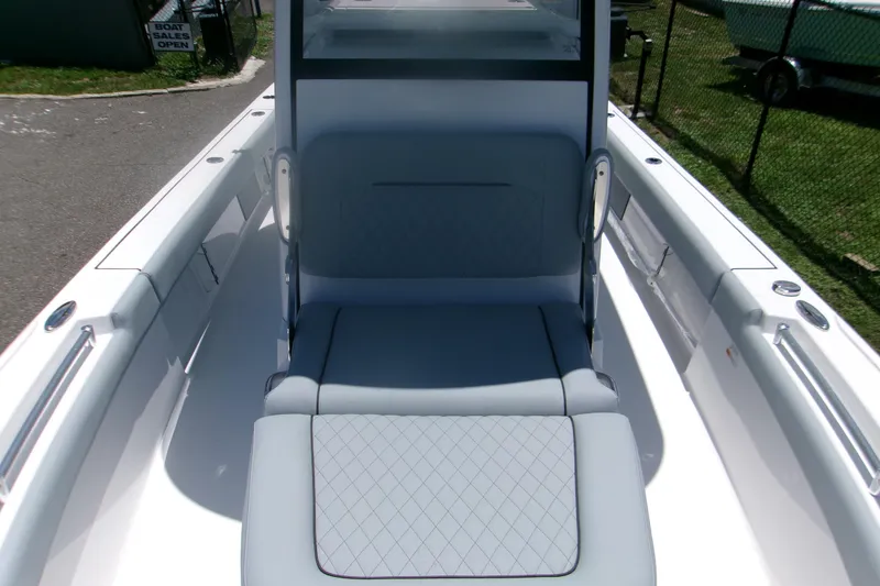 Slide: The Image of 2027 Sportsman Masters 247OE Bay Boat interior with cushioned seating and sleek design. - 14