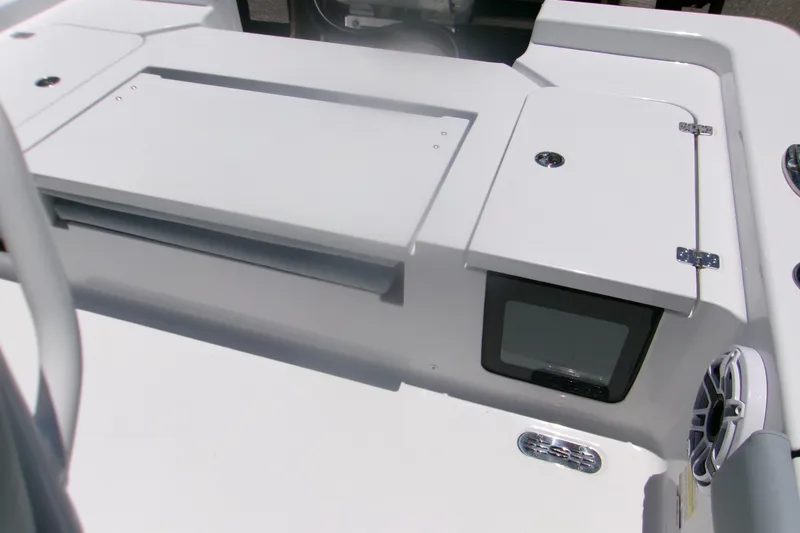 Slide: The Image of 2027 Sportsman Masters 247OE Bay Boat deck with storage compartments and speaker. - 9