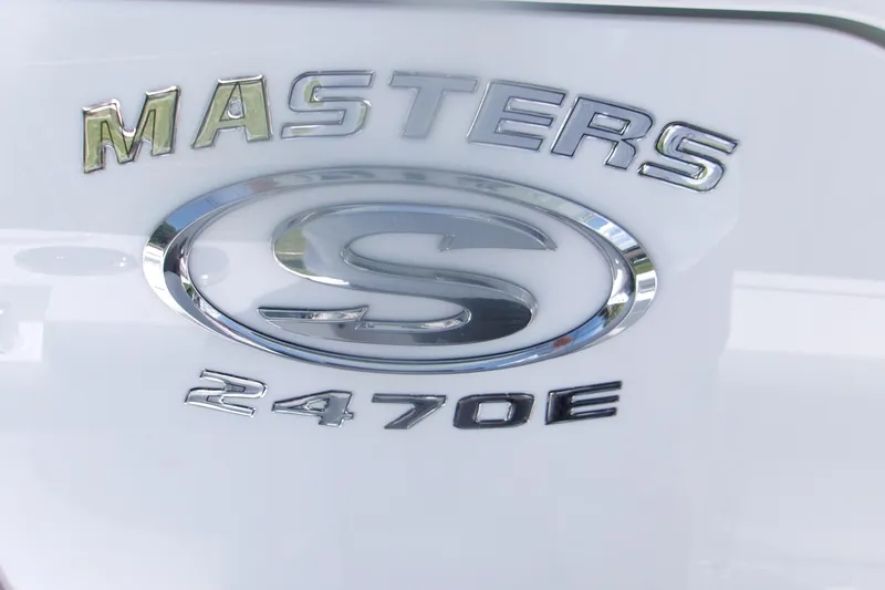 Slide: The Image of 2027 Sportsman Masters 247OE Bay Boat emblem on white surface. - 18