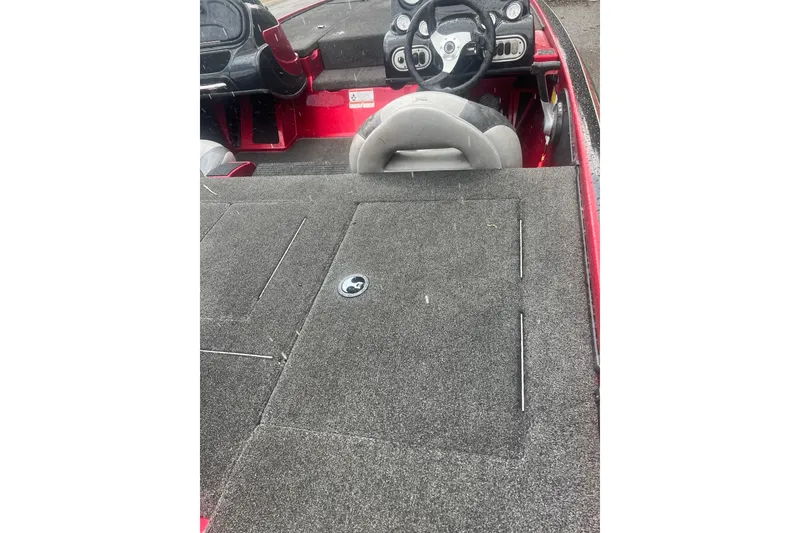 Slide: The Image of 2013 Nitro Z-6 boat interior with steering wheel and carpeted deck. - 3