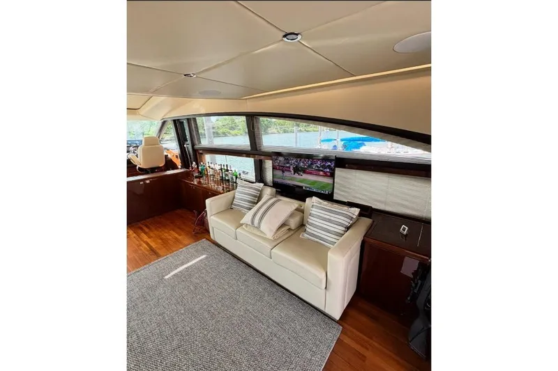 Slide: The Image of Luxurious interior of 2009 Princess 85 Motor Yacht with sofa, TV, and bar area. - 5