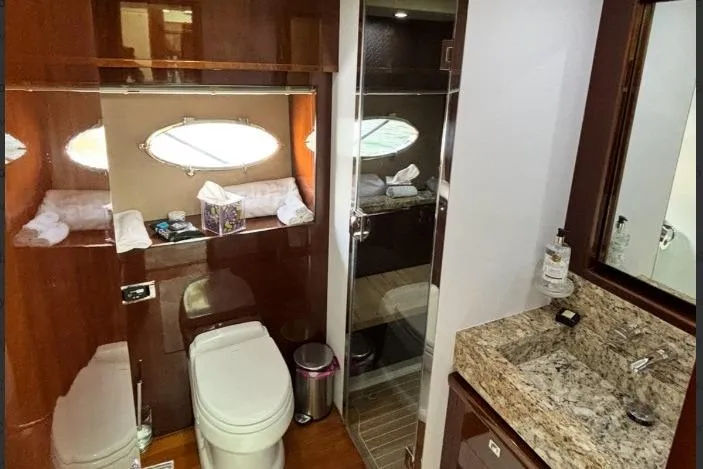 Slide: The Image of Luxurious bathroom on a 2009 Princess 85 Motor Yacht with granite countertop and shower. - 12
