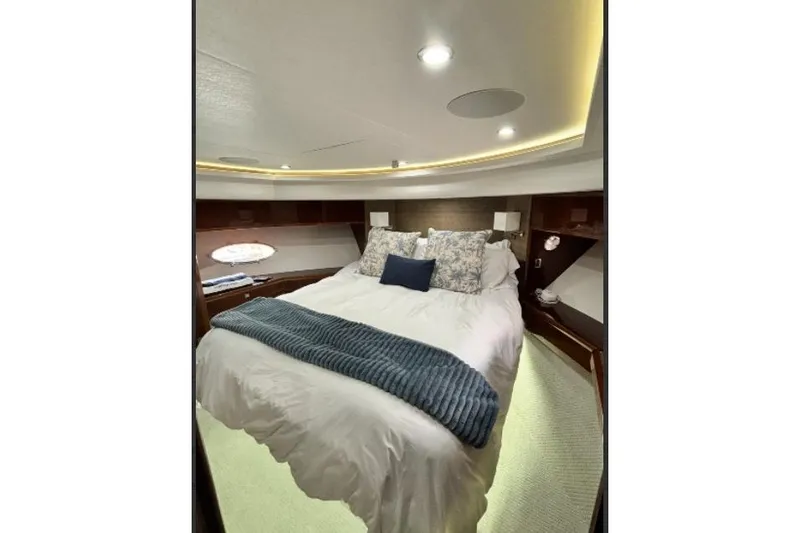 Slide: The Image of Luxurious bedroom interior of 2009 Princess 85 Motor Yacht with elegant bedding and ambient lighting. - 11