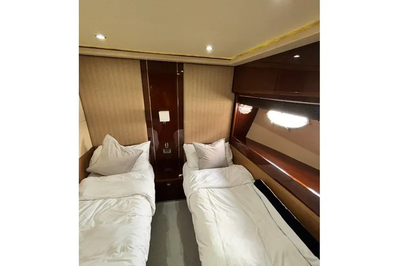 Slide: The Image of Luxurious twin cabin interior on 2009 Princess 85 Motor Yacht, featuring elegant wood finishes. - 13