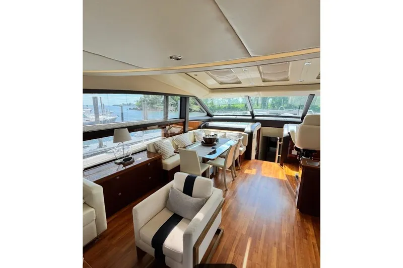 Slide: The Image of Luxurious interior of 2009 Princess 85 Motor Yacht with elegant seating and panoramic windows. - 3