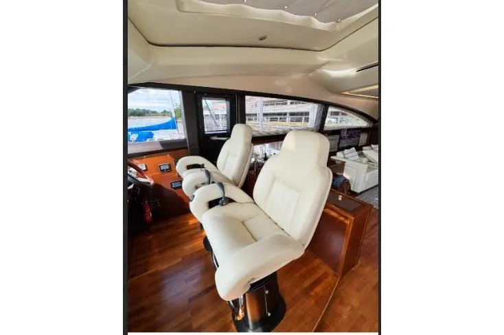 Slide: The Image of Luxurious interior of 2009 Princess 85 Motor Yacht with plush white seating. - 2